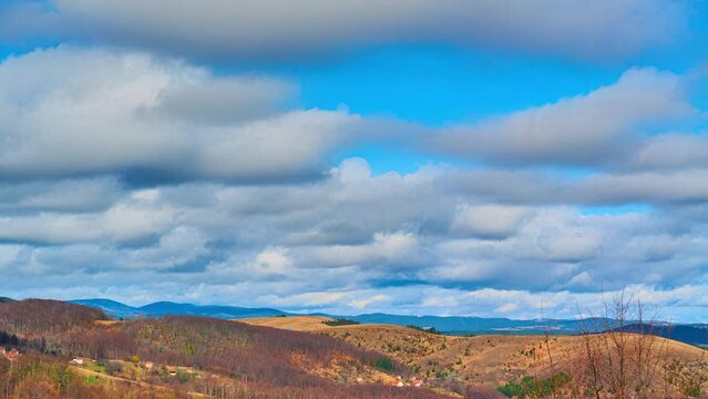 Nature landscape cumulus clouds rolling over hills and mountains time-lapse