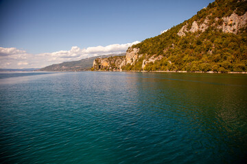 Fototapeta premium Lake Ohrid, a lake which straddles the mountainous border between the southwestern part of North Macedonia and eastern Albania