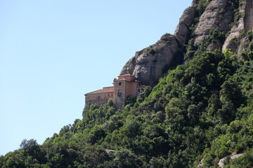 Fototapeta na wymiar Old and small church on top of mountain Montserrat near Barcelona, Catalonia, Spain