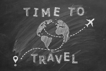Globe with lettering TIME TO TRAVEL and airplane following a path marked with location pins suggesting a travel or education concept. Hand drawn illustration with chalk on a blackboard.