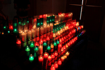 Candles in Montserrat monastery on mountain in Barcelona, Catalonia. - obrazy, fototapety, plakaty