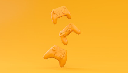 Video game joysticks or gamepads in plain monochrome yellow color background
