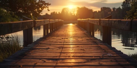 A wooden bridge over a body of water with the sun setting in the background
