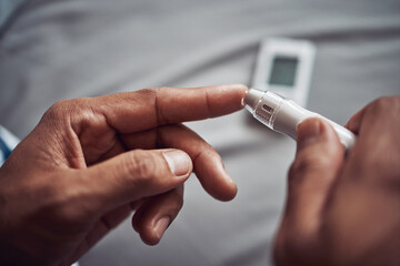 Person, hand and blood sugar with finger for diabetes test or monitor insulin, glucometer or home....