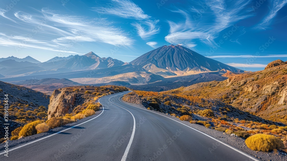 Poster a long road with a mountain in the background. the road is empty and the sky is clear