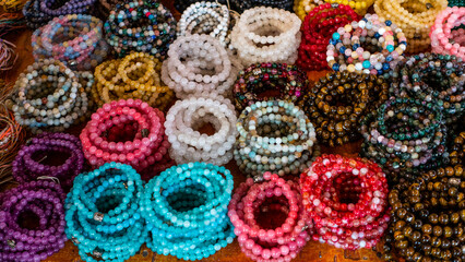 Bali March 2024 - Stall for sale in streets with souvenirs for tourists. necklaces and bracelets,...
