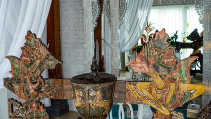 Bali March 2024 – Ancient Garuda carved wooden artwork in a villa. Bali island. Indonesia.