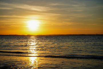 Sun set over a sandy beach and ocean in England