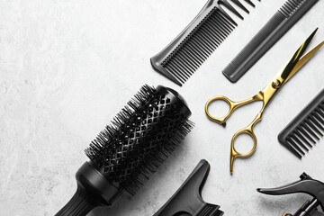 Hairdressing tools on light background, flat lay. Space for text