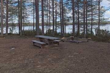 Camping area near lake shore in cloudy spring weather, Iikoski, Hossa National Park, Suomussalmi, Finland.