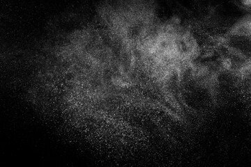 Abstract dust overlay texture. White particles on black background. Powder explosion.	

