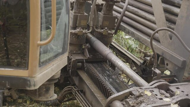 Horizontal directional drilling machine works in city park. Professional equipment for installing pipelines without disrupting surface