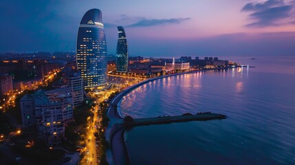 Aerial view of Baku, modern architecture and Caspian Sea, evening lights