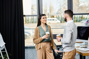 A man and a woman engage in a strategic dialogue within a corporate office setting, deep in...