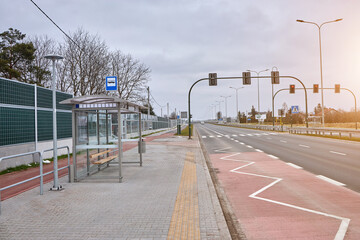 Fototapeta na wymiar transparent bus stop on the road.