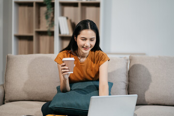 Happy lady working sitting on sofa at home office. successful entrepreneurship and career concept.