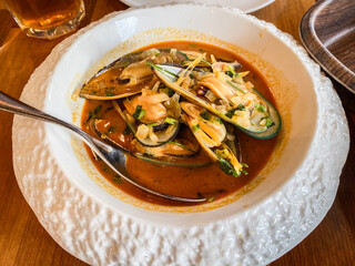 Savory Seafood Delight in a Spicy Broth Bowl