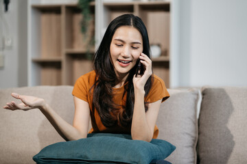 Happy lady working sitting on sofa at home office. successful entrepreneurship and career concept.