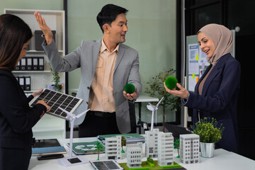 Architect team working with blueprints for sketching a construction project, green energy and solar panel concept.