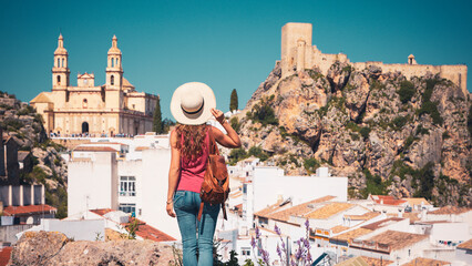 Rear view of female tourist visiting Olvera, Typical white village in Andalusia, Spain