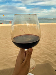 A glass of wine with beach view