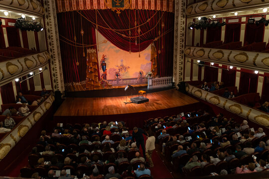 Theater full of people with phones in their hands