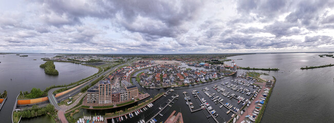 Panorama of Veluwemeer aerial with Harderwijk recreational port and highway passing in the...
