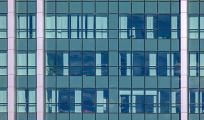 Green Windows Glass Facade at Modern Office Building