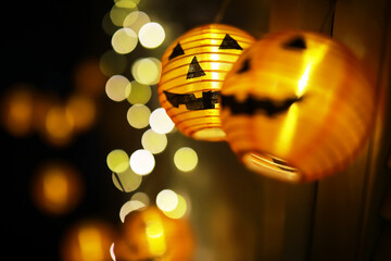 The concept of light on the night Halloween.Round lamp shape of pumpkin used to decorate with bokeh...