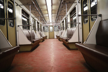 Subway car with empty seats. Empty subway. - obrazy, fototapety, plakaty