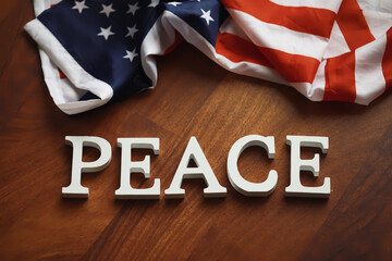 Peace Word Written In Wooden Letters. International conflict, American hegemony, War. Ukraine and...