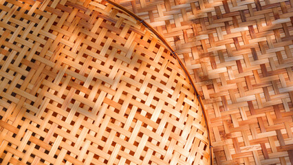 Two bamboo threshing baskets texture background with sunlight and shadow on surface, top view with copy space