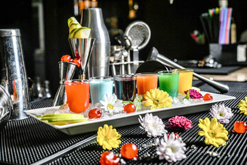 Refreshing Drink Tray With Colorful Flowers on Table