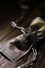 The American currency is dollars, tied with a chain. The concept of blocking payments and transfers...