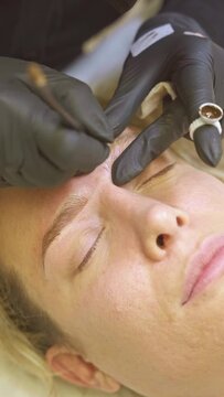 Detailed microblading session by a professional beautician