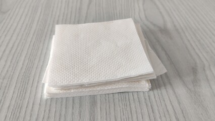 Stack of white paper napkins on the table