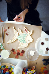 Fototapeta premium The process of creating a fish-shaped mosaic. 