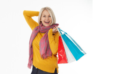 Shopper. Shopaholic shopping woman holding many shopping bags excited isolated on white.