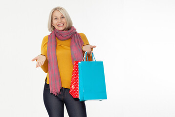 Shopper. Shopaholic shopping woman holding many shopping bags excited isolated on white.