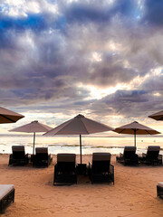 gazebo and chair at beach against blue sky