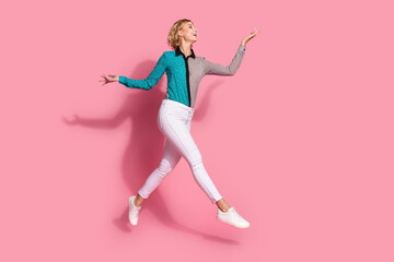 Fototapeta na wymiar Full size photo of pretty young girl running hurry shopping wear trendy striped cyan outfit isolated on pink color background