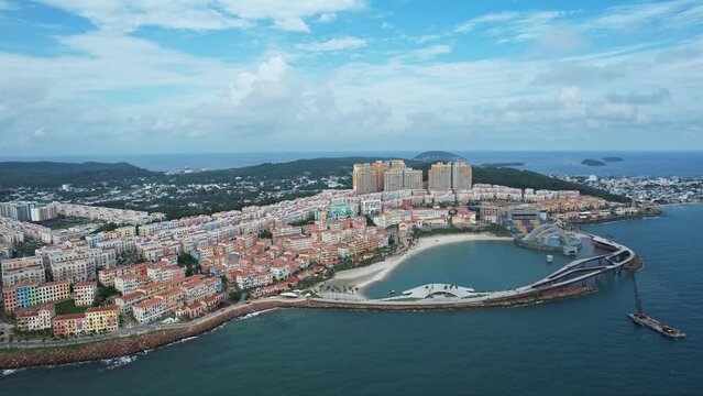 City on island surrounded by azure water, buildings, ocean views on sunny day in Italian village Phu Quoc island Vietnam