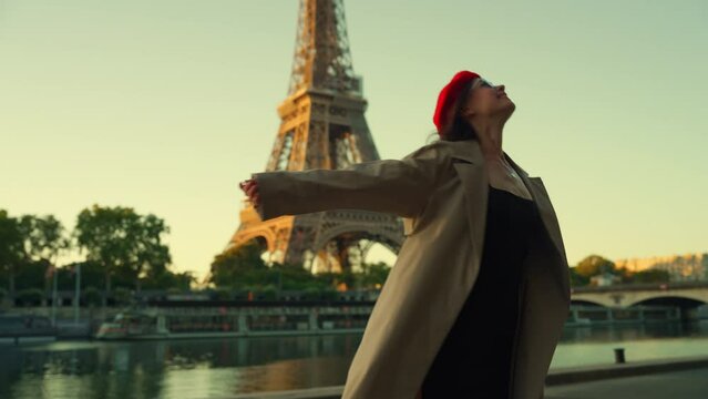 Person with Red Beret Facing the Eiffel Tower