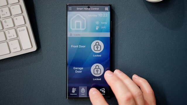 Hand Using Mobile Phone With Home Control System