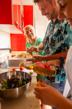 Family cooking together in a vibrant kitchen