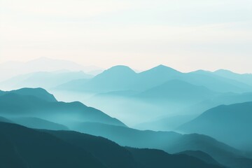 Serene landscape of layered mountain silhouettes enveloped in a soft morning mist