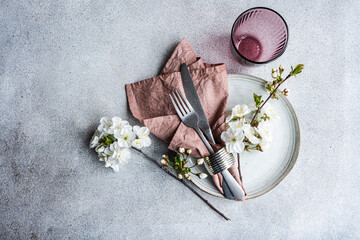 Elegant spring table setting with cherry blossoms