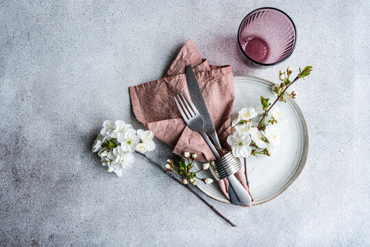 Elegant spring table setting with cherry blossoms