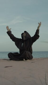Monk Asks For Help From The Most High Almighty Sitting On The Beach In Prayer