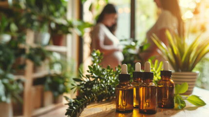 Brown dropper bottles of aromatherapy essential oil with pregnant women in a cozy environment in the background